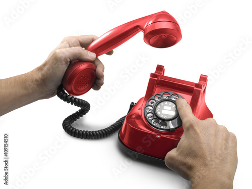 old Red telephone dial with hands.(clipping path)