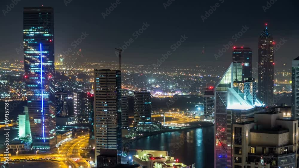 Scenic aerial view of a big modern city at night timelapse. Business bay, Dubai, United Arab Emirates. Scenic aerial view of a big modern city at night timelapse. Business bay, Dubai, United Arab Emirates.