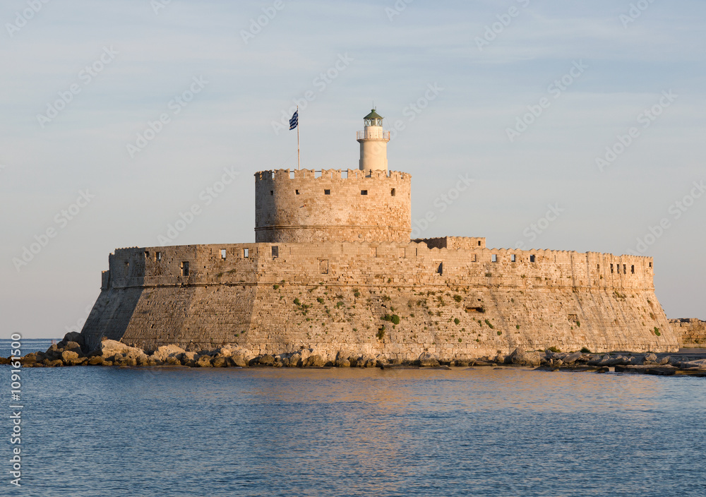 Medieval fortress in Mandraki Harbor. Rhodes Island, Greece. Rhodes city.