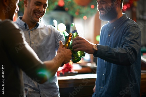 Friends in public house making a toast