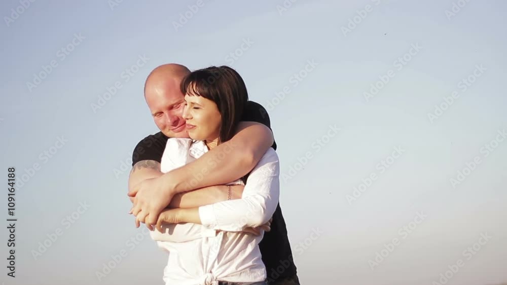 A loving couple man and woman at sunset A loving couple man and woman at sunset