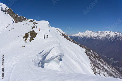 Snowboarders walking uphill for freeride, extreme sport