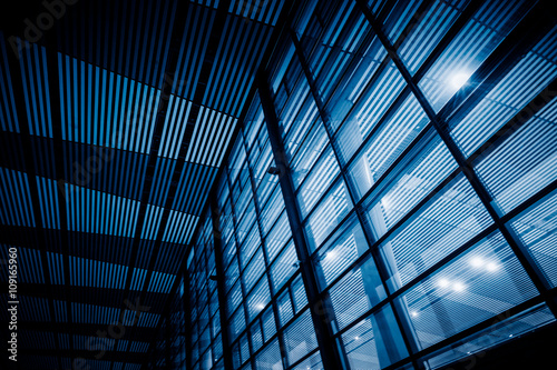 low angle view of steel glass airport ceiling ,chongqing china,blue toned image.
