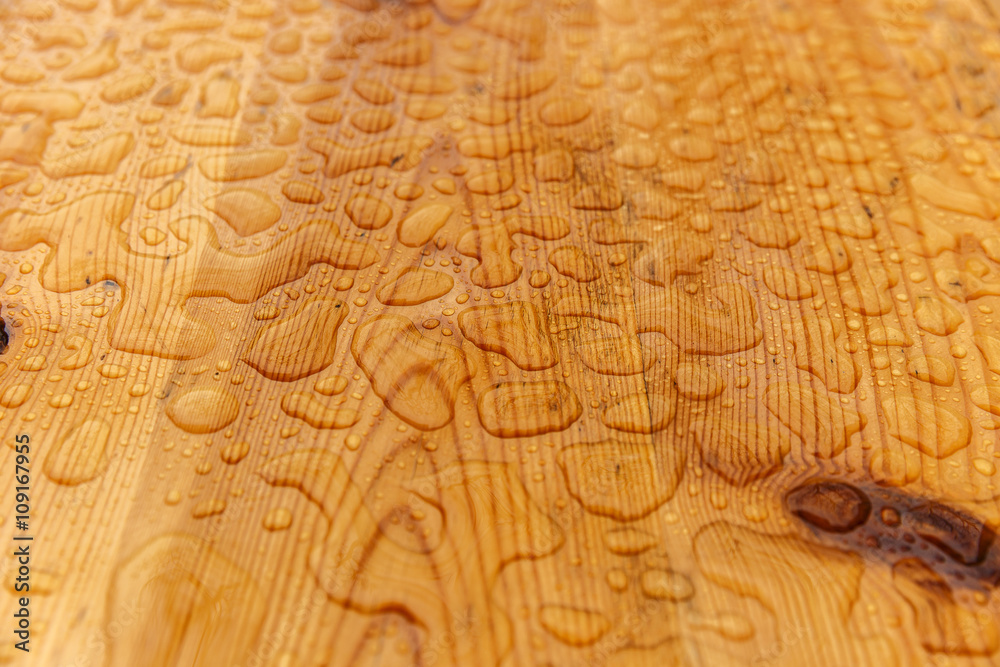 Raindrops on a wooden table