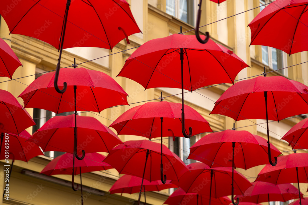 Red umbrellas covering a street in Belgrade, parasols used as street decoration