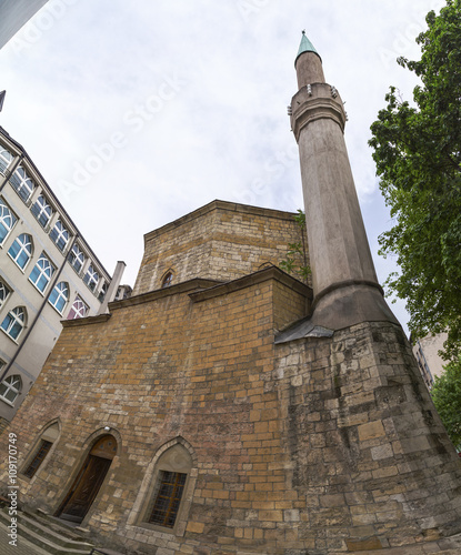 An Ottoman style mosque with minaret. The Bajrakli mosque is the only remaining mosque in Serbia which was built around 1575 by the Turkish Ottoman Empire. photo