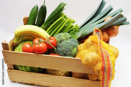 Fruits and vegetables in a wooden box