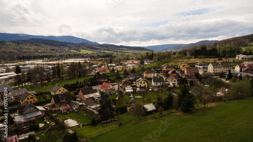 Aerial View. Panorama over a green grassy in mountains.