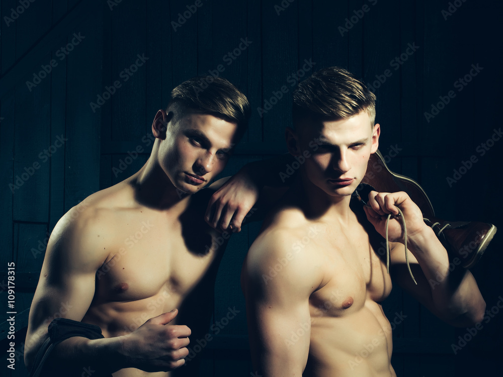 Twins with muscular torso