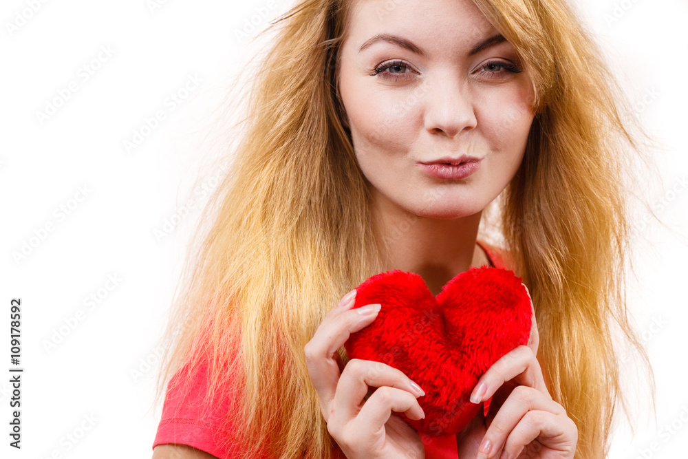 Woman blonde girl holding red heart love symbol