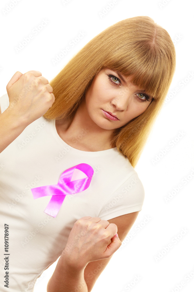 Woman wih pink cancer ribbon on chest punching Woman wih pink cancer ribbon on chest punching