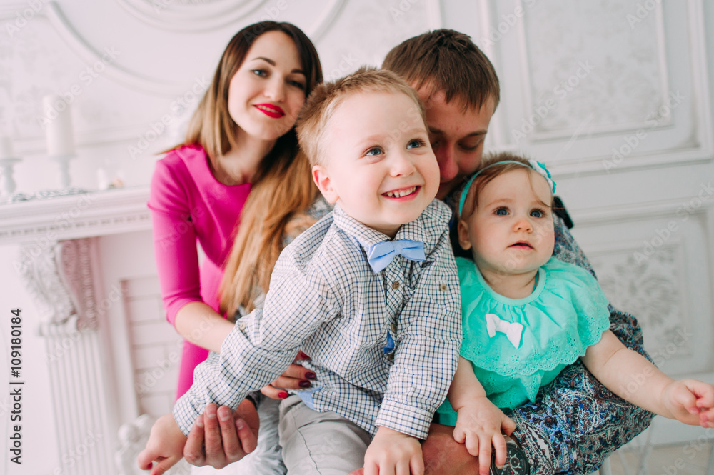 Beautiful family portrait spending time together at studio Beautiful family portrait spending time together at studio