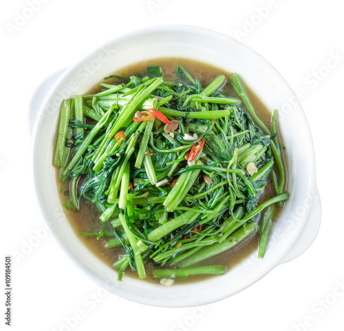 Stir Fried Water Spinach or pak boong fai daeng on white dish,clipping path