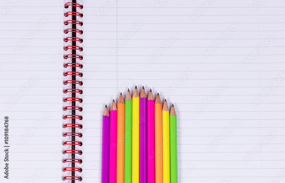Pencil tips on a spiral notebook background Pencil tips on a spiral notebook background