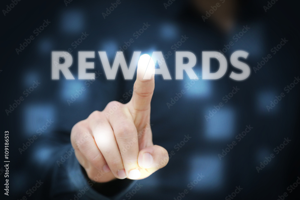 Businessman touching Rewards Businessman touching Rewards