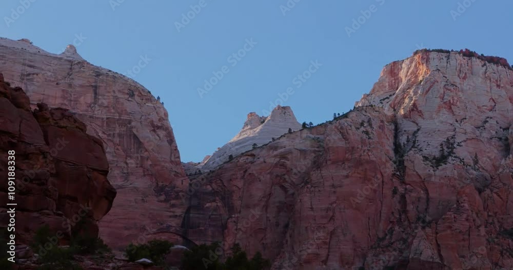 Red rock cliffs rise above Zion National Park. Red rock cliffs rise above Zion National Park.