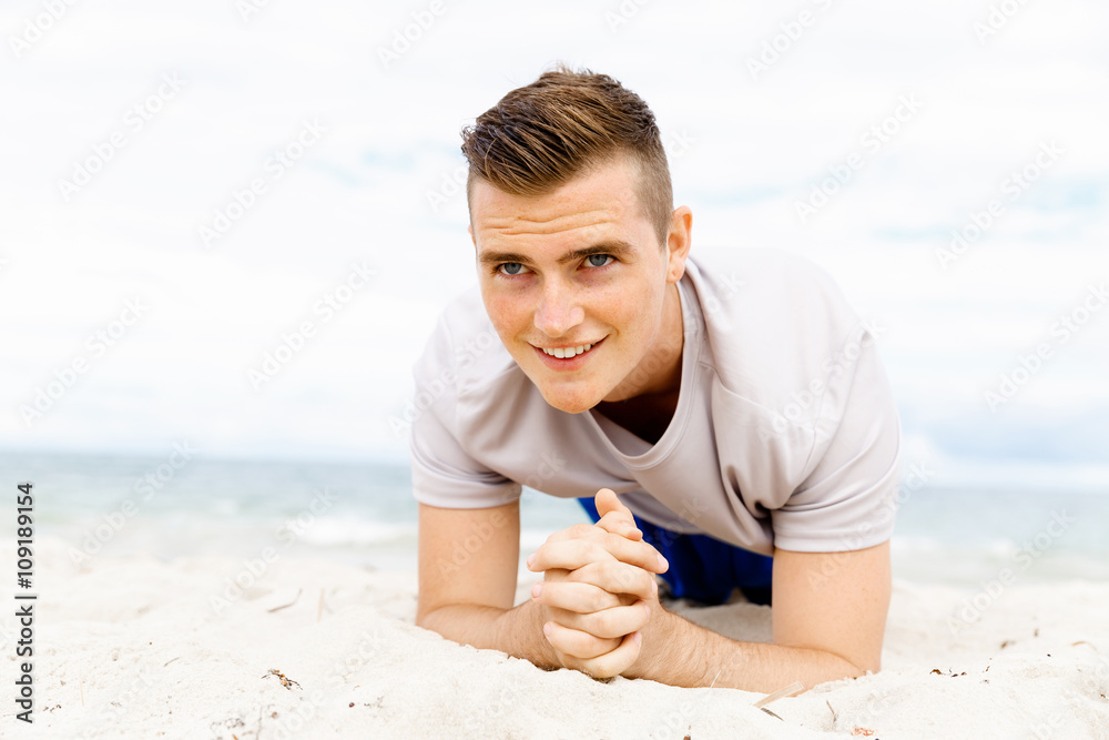 Man training on beach outside Man training on beach outside