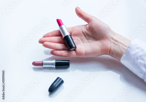 female hand and cosmetics