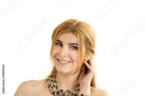 portrait of the young beautiful woman with a necklace