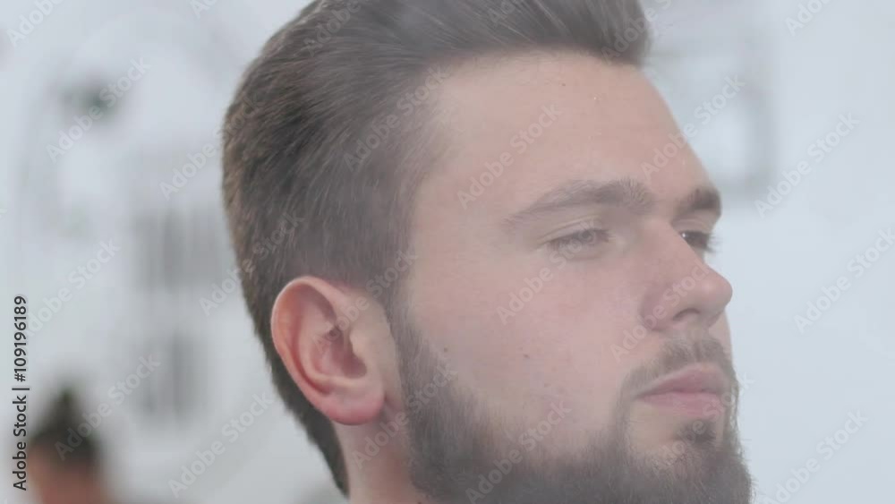 Handsome man in the barbershop. Slow motion. Close up. Handsome man in the barbershop. Slow motion. Close up.