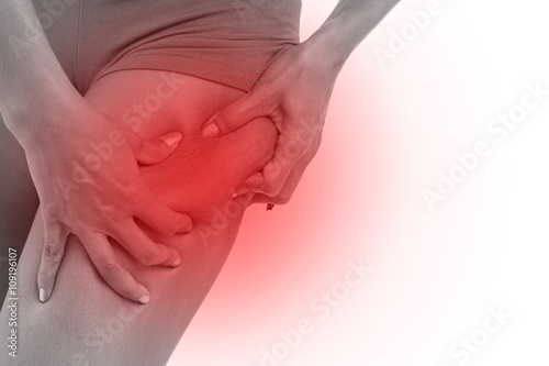 Wallpaper Mural woman's hand holding excessive leg fat or cellulite, isolated on Torontodigital.ca