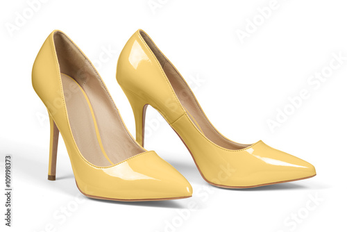 A pair of yellow high heel shoes isolated on white with clipping path.