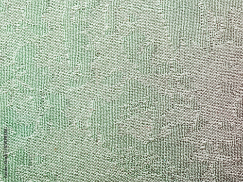 textile background - green batik silk fabric