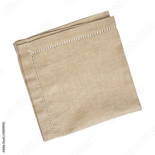Brown linen napkin isolated on white background photo