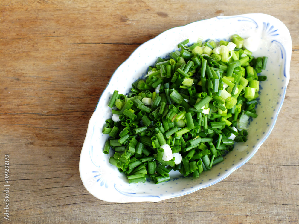 fresh spring onion chopped green onions on wooden background fresh spring onion chopped green onions on wooden background