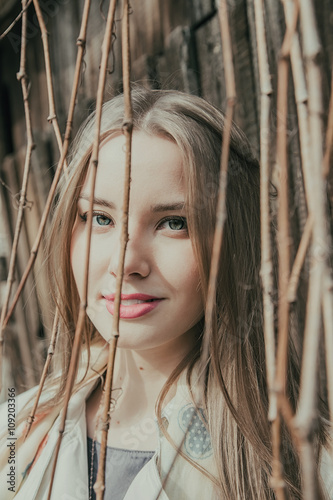 Portrait of a beautiful girl. Cold spring, windy weather.