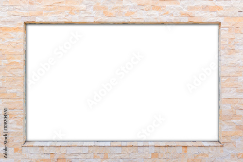 Blank white billboard on brick wall.