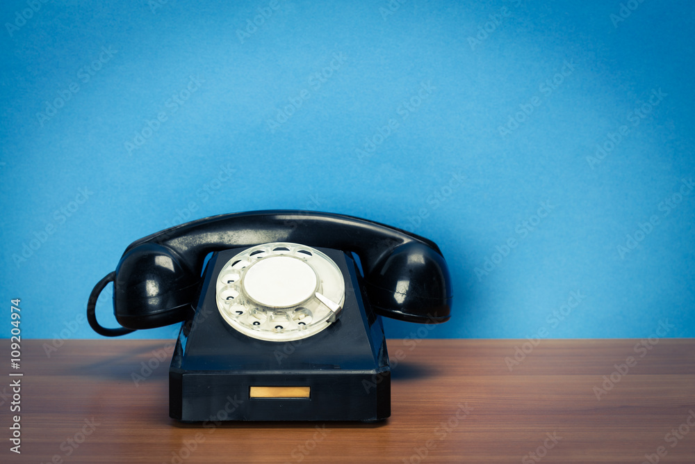 Retro telephone on table Retro telephone on table