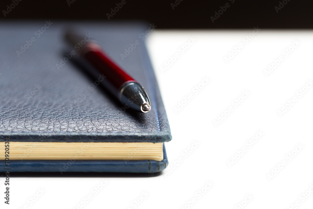 Pen and notebook close up Pen and notebook close up