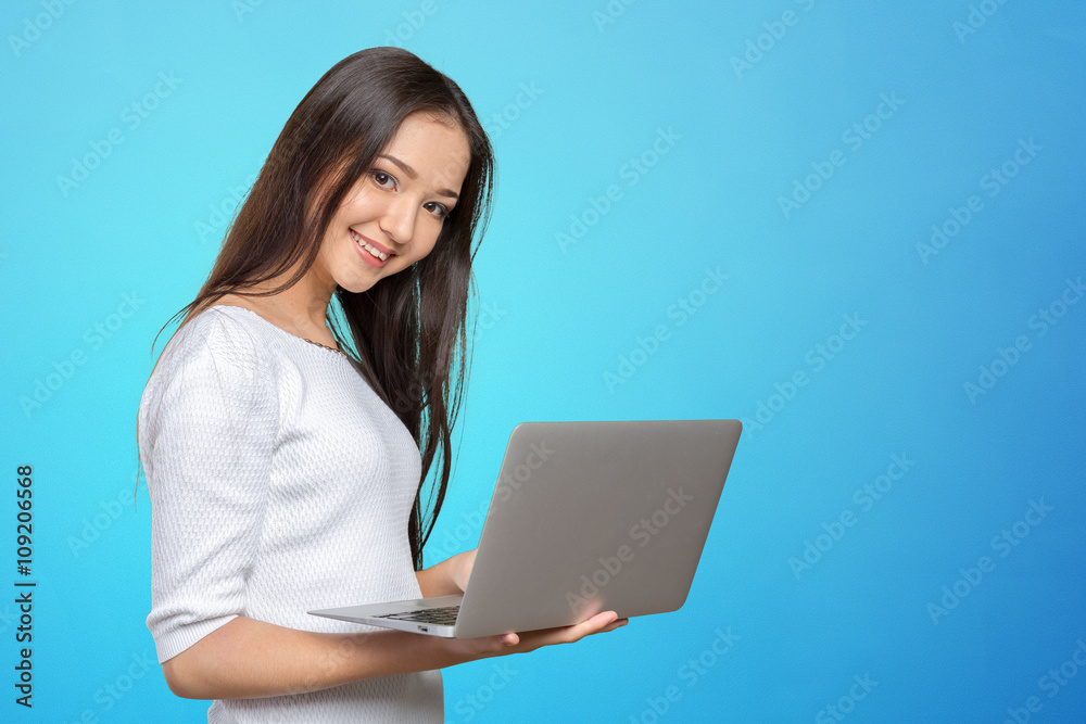 portrait of beautiful young woman holding laptop isolated portrait of beautiful young woman holding laptop isolated