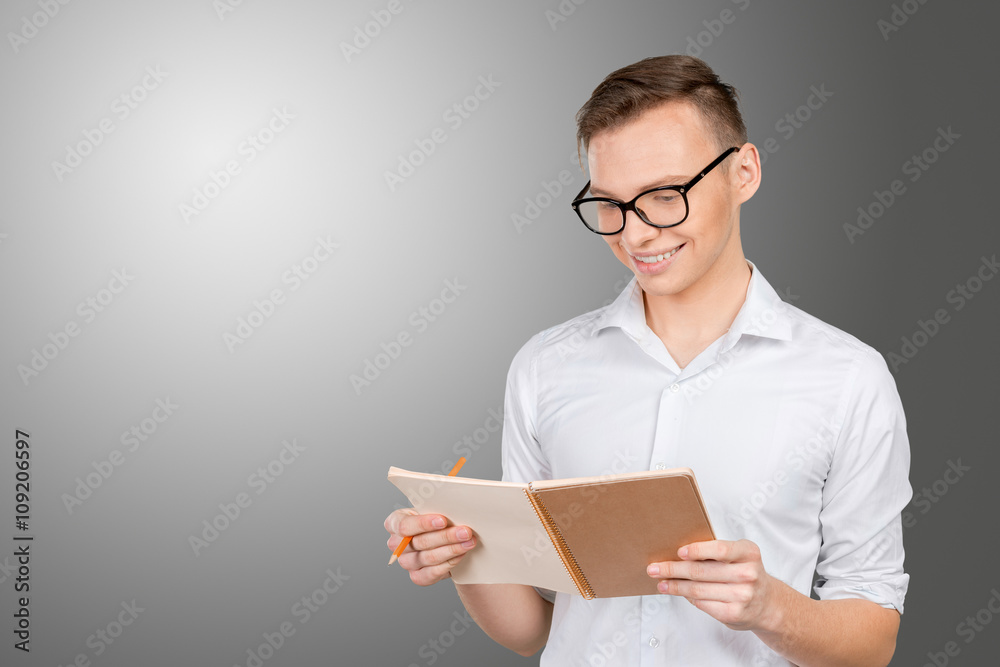 Handsome thoughtful man reading a note Handsome thoughtful man reading a note