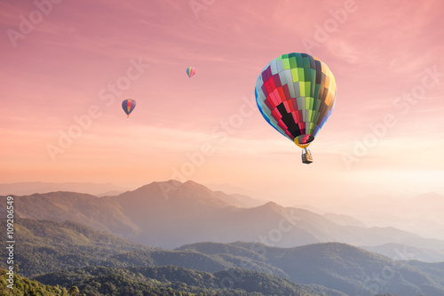 Hot air balloon over high mountain at sunset © littlestocker