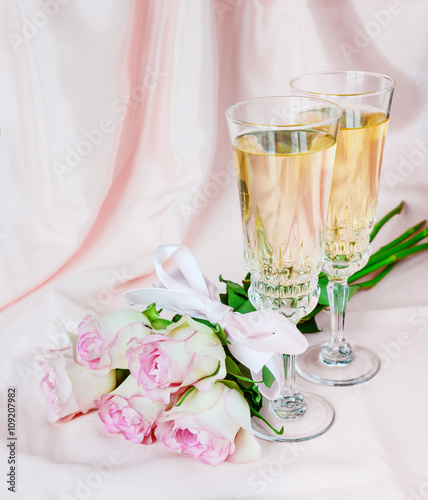 Wine and pink roses