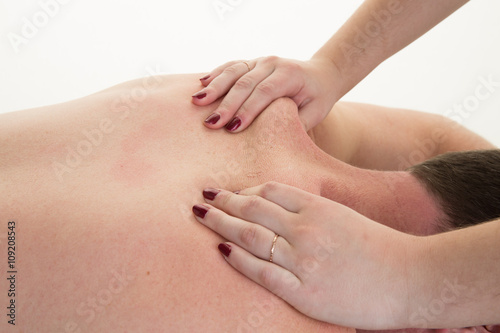 Close-up of a man's back having a massage in a spa center