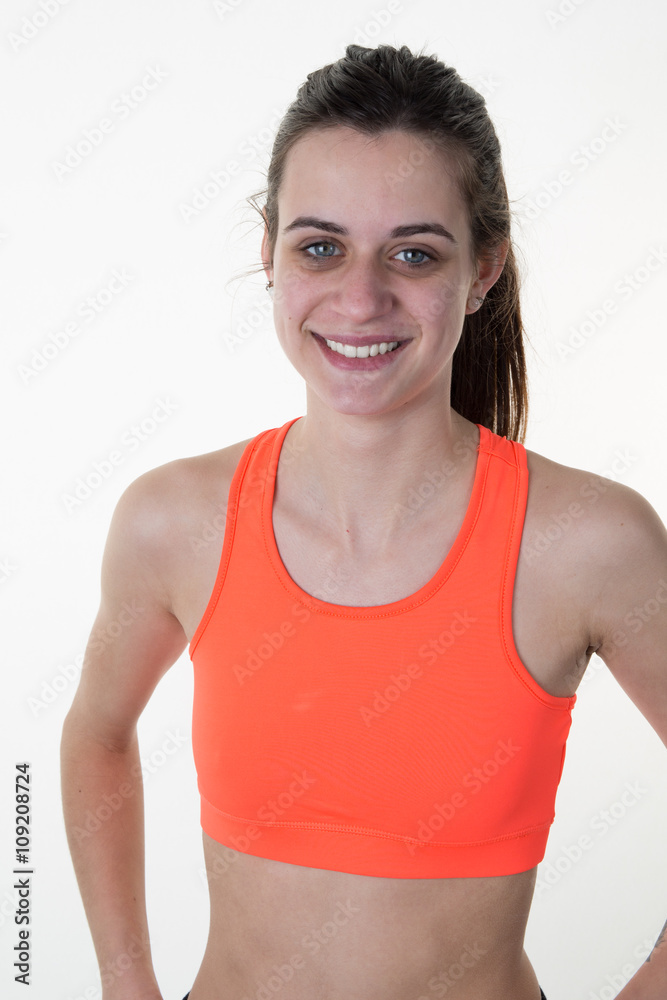 Woman in orange sports wear isolated on white background Woman in orange sports wear isolated on white background