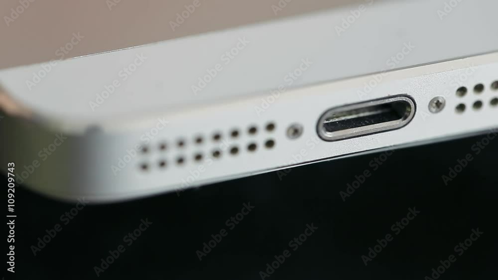 Usb White Cable Connected to a Phone. Macro Shot. Usb White Cable Connected to a Phone. Macro Shot.