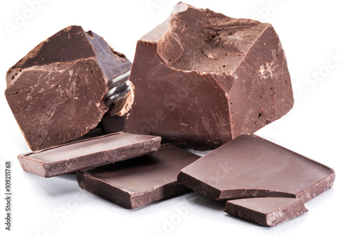 Chocolate blocks and pieces of chocolate bar isolated on a white