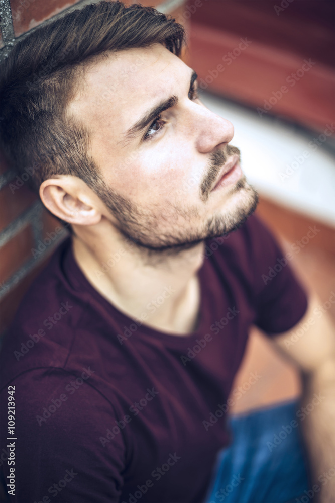 Handsome caucasian young man in casual clothes in urban environm Handsome caucasian young man in casual clothes in urban environm