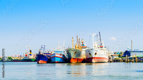Fishing boats and ships in the Tha Chin river harbor of thailand