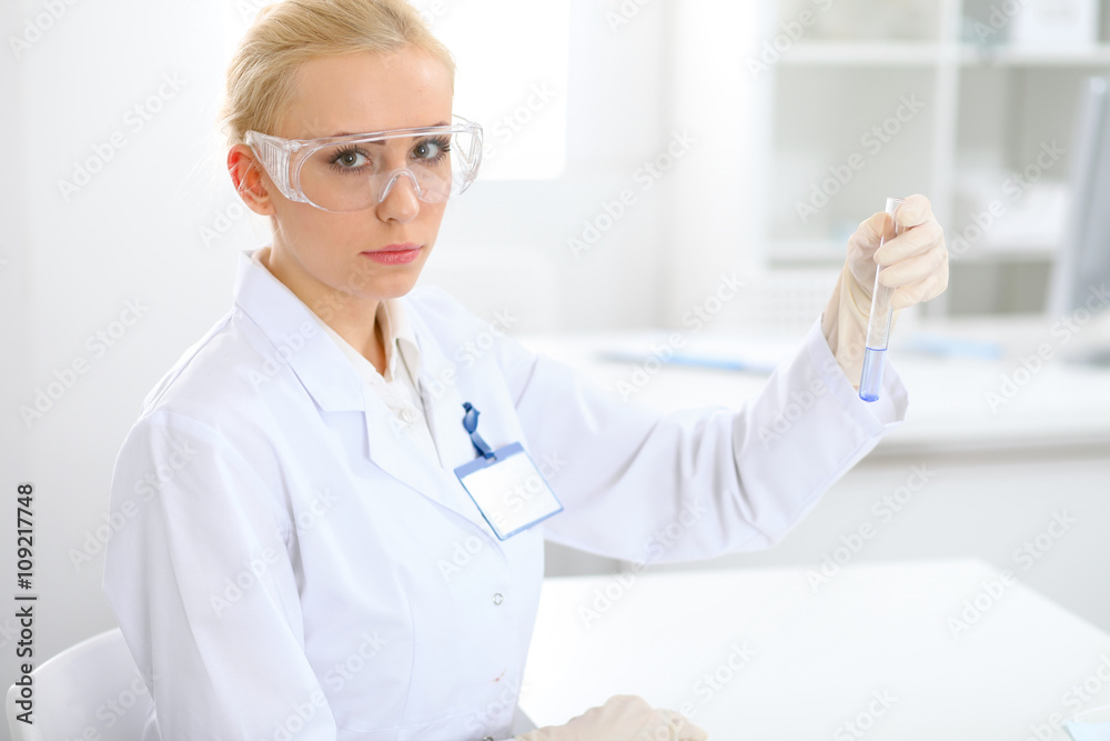 Scientific research team with clear solution in laboratory Scientific research team with clear solution in laboratory