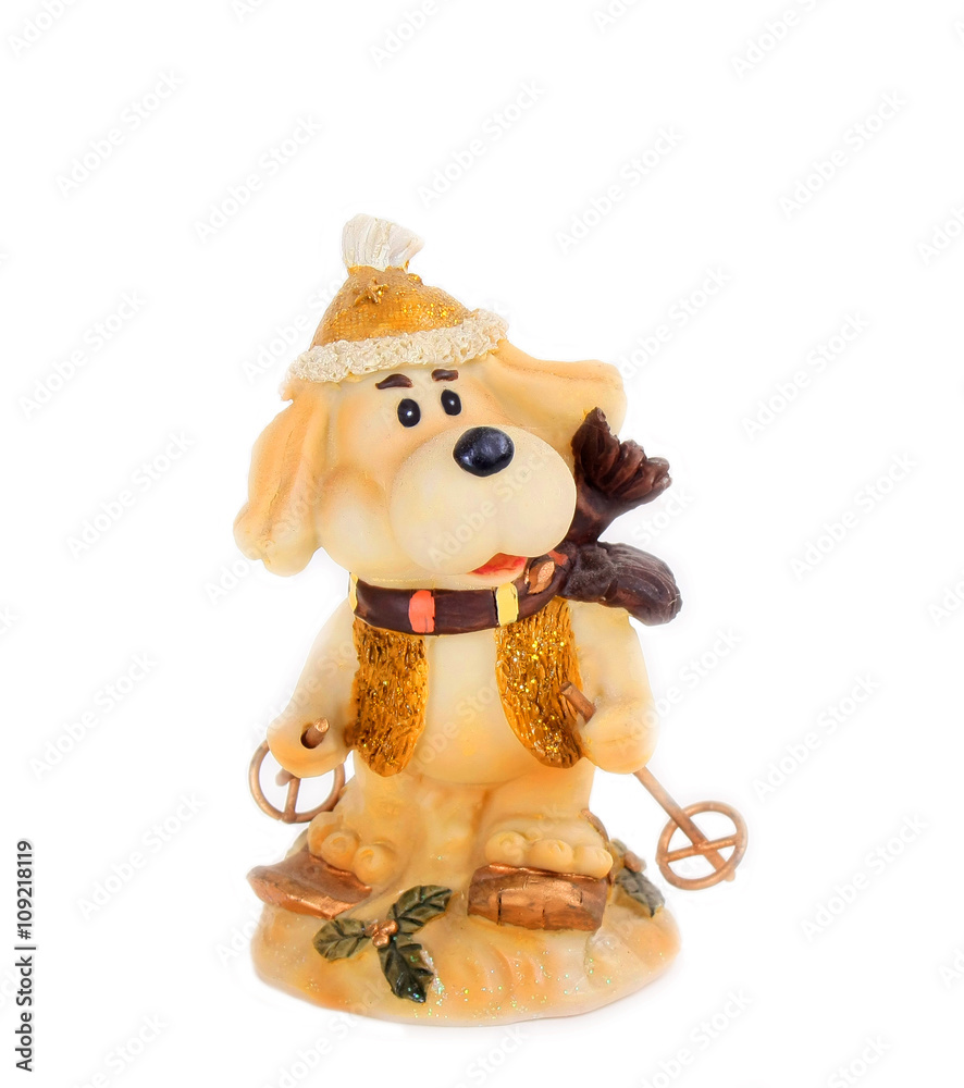 Toy dog skiing. Winter fun. Porcelain animal. Cute and funny statuette. Beautiful toy animal. Isolated object on a white background. Toy dog skiing. Winter fun. Porcelain animal. Cute and funny statuette. Beautiful toy animal. Isolated object on a white background.