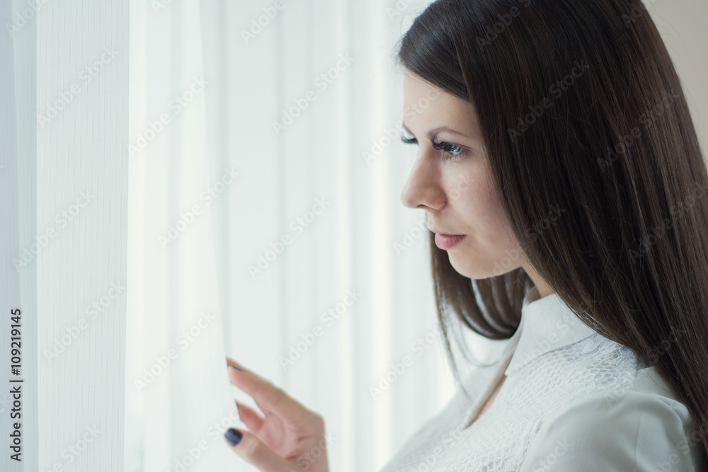 Beautiful girl in the office near the window Beautiful girl in the office near the window