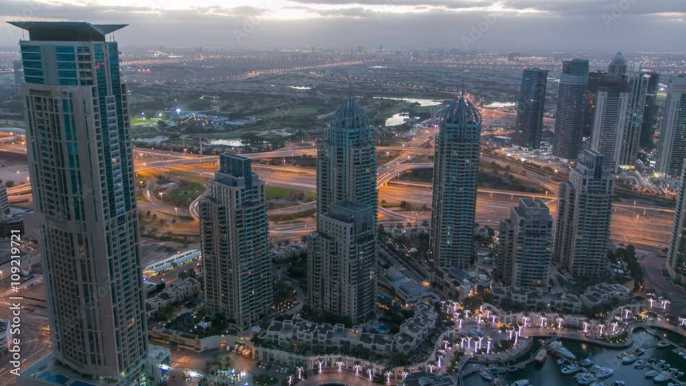 Dubai marina harbor panorama from night to day transition timelapse Dubai marina harbor panorama from night to day transition timelapse