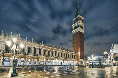 St Mark's campanile and the Biblioteca Nazionale Marciana at night, Venice, Italy photo