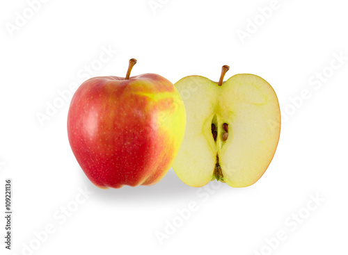 Red ripe apple is cut in half
