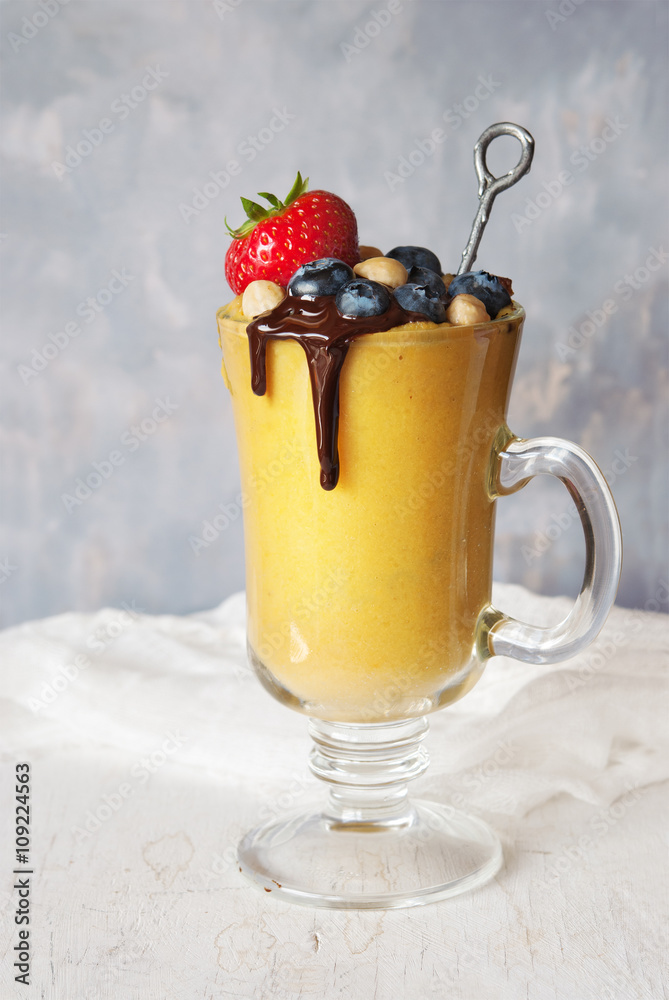 Mango smoothie and berries Mango smoothie and berries